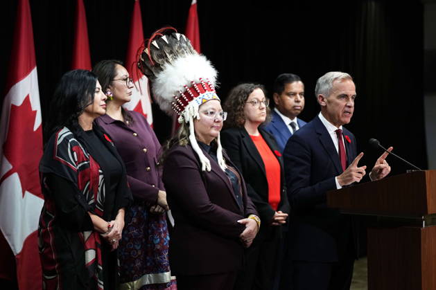 October 26, 2026, Ottawa, On, Canada: Prime Minister Mark Carney is joined by National Chief of the Assembly of First Nations Cindy Woodhouse Nepinak and cabinet ministers as he speaks at a news conference at the conclusion of a First Nations and First Ministers meeting in Ottawa, on Monday, Oct. 26, 2026. Ottawa Canada  - ZUMAc35_ 20261026_zaf_c35_118 Copyright: xJustinxTangx