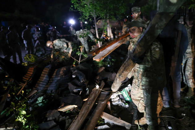 Tornado damages dozens of homes in central Chile REQUINOA, CHILE - OCTOBER 26: Soldiers help with cleanup efforts in the affected area as buildings and infrastructure sustain damage after a tornado strikes the commune of Requinoa in Chile s O Higgins region on October 26, 2026. The weather event is preliminarily classified as an EF2 tornado, associated with wind speeds of 179 to 218 kilometers per hour. Approximately 70 properties are affected, one person sustains minor injuries, and around 3,000 customers are left without electricity. Lucas Aguayo Araos Anadolu Requinoa Chile. Editorial use only. Please get in touch for any other usage.  Copyright: x2026xAnadoluxLucasxAguayoxAraosx