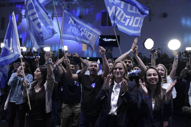 Yashar Supporters Celebrate Exit Polls A man shouts with his arms raised behind applauding women while Yashar flags fly above the crowd in Tel Aviv, Israel, on October 27, 2026. The gathering followed the release of initial television exit-poll projections in Israel s election for the 26th Knesset; the projections were preliminary, not official vote results. Tel Aviv Tel Aviv Israel Copyright: xTomerxNeubergx