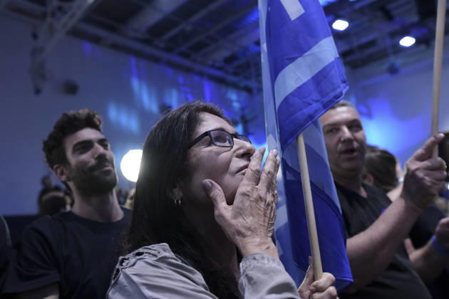 Yashar Supporters Celebrate Exit Polls A woman holds a Yashar flagpole and calls out with her hand near her mouth while other supporters watch and cheer in Tel Aviv, Israel, on October 27, 2026. Supporters of Yashar, the party led by former Israeli military chief Gadi Eisenkot, gathered in Tel Aviv as initial exit polls were released following voting in the 26th Knesset election. Tel Aviv Tel Aviv Israel Copyright: xTomerxNeubergx