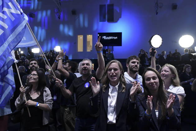 Yashar Supporters Celebrate Exit Polls A woman claps and smiles beside other supporters raising their hands and Yashar party flags after the first exit-poll projections in Tel Aviv, Israel, on October 27, 2026. The gathering followed the release of initial television exit-poll projections in Israel s election for the 26th Knesset; the projections were preliminary, not official vote results. Tel Aviv Tel Aviv Israel Copyright: xTomerxNeubergx