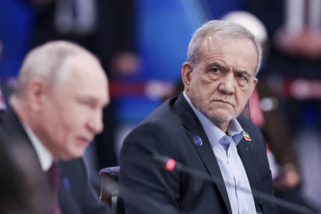 October 27, 2026, Moscow, Russian Federation: Russian President Vladimir Putin, remarks as Iranian President Masoud Pezeshkian, right, looks on during a plenary session of the 8th summit of the Gas Exporting Countries Forum, October 27, 2026 in Moscow, Russia. Moscow Russian Federation - ZUMAp138 20261027_zaa_p138_022 Copyright: xStepanxPugachev RoscongressxFounx