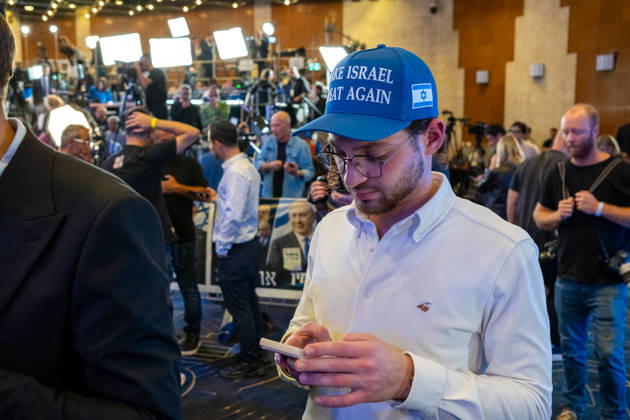Israel, Jerusalem, October 27–28, 2026: Scenes from the election rally of the Likud Party led by incumbent Prime Minister Benjamin Netanyahu. There was a long wait for Bibi to appear; he didn’t take the stage until around 3:15 a.m. Baseball caps bearing the slogan Make Israel Great Again were handed out at the event.