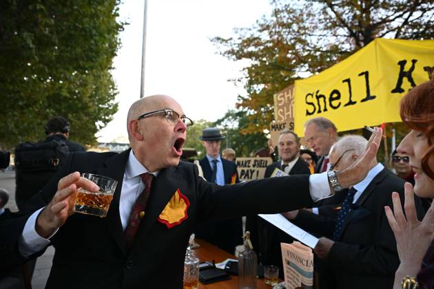 Climate activists hold demonstration in London LONDON, UNITED KINGDOM - OCTOBER 28: Climate activists stage a protest near the headquarters of energy company Shell, following a call by environmental group Fossil Free London, in London, United Kingdom, on October 28, 2026. During the demonstration, activists dressed as executives take part in a theatrical performance, throwing fake banknotes into the air and displaying banners criticizing the company s profits and fossil fuel activities. Rasid Necati Aslim Anadolu London United Kingdom. Editorial use only. Please get in touch for any other usage.  Copyright: x2026xAnadoluxRasidxNecatixAslimx