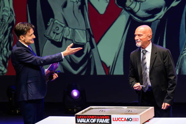 October 28, 2026, Lucca, Lucca, Italy: Claudio Castellini, author of the Lucca Comics & Games 2026 poster, on the occasion of the 60th anniversary of the event, enters the Lucca Comics & Games Walk Of Fame by leaving his fingerprints on the tile, autographing it to remain in the history of the event, Lucca, 28 10 2026 Lucca Italy - ZUMAa289 20261028_zia_a289_152 Copyright: xStefanoxDallexLuchex xAgfx