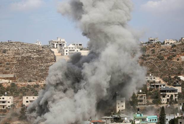Israeli forces demolish homes of two Palestinian prisoners in the West Bank NABLUS, WEST BANK, PALESTINE - OCTOBER 28: Plumes of smoke rise as Israeli forces detonate the home of Palestinian prisoner Ibrahim Dawood using explosives during a military raid in Beita town, south of Nablus in the West Bank, Palestine on October 28, 2026. Issam Rimawi Anadolu Nablus West Bank. Editorial use only. Please get in touch for any other usage.  Copyright: x2026xAnadoluxIssamxRimawix