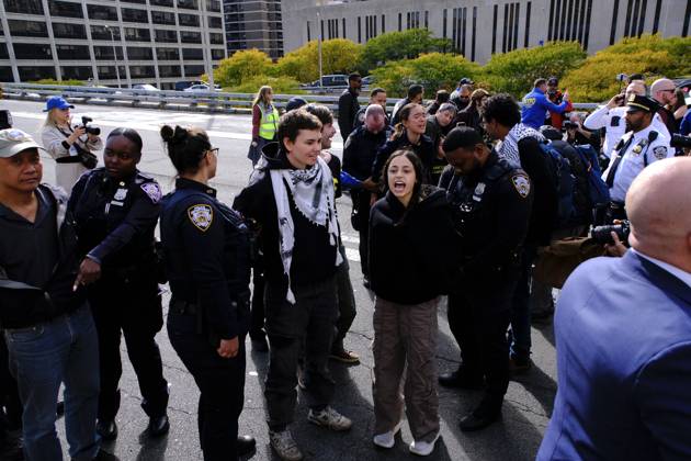 NEW YORK, NY- OCTOBER 28: 13 activists were arrested on the Brooklyn Bridge to demand I.C.E stop shooting New Yorkers on October 28, 2026 in New York City. Copyright: xKatiexGodowski MediaPunchx