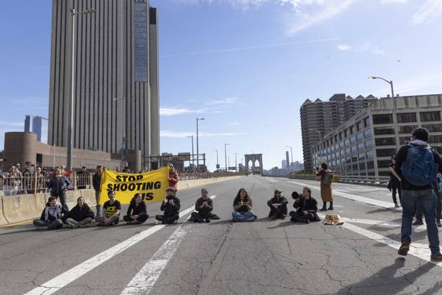 October 28, 2026, New York, New York, USA: Anti-ICE (U.S. Immigration and Customs Enforcement) demonstrators blockade the roadway on the Brooklyn Bridge with a banner that reads STOP SHOOTING US protesting the continued detainment of O. Belgal, who was shot by federal agents in the Bronx with his 5-yr-old son in the car. The demonstration stopped Brooklyn bound traffic and results in arrests by NYPD. Protesters call for ICE out of New York. New York USA - ZUMAr174 20261028_znp_r174_015 Copyright: xGinaxMxRandazzox