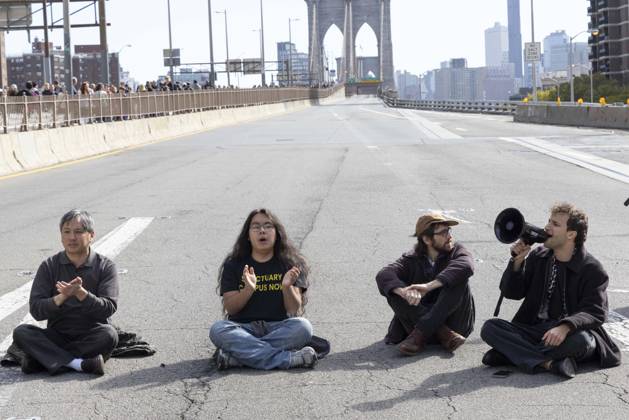 October 28, 2026, New York, New York, USA: Anti-ICE (U.S. Immigration and Customs Enforcement) demonstrators sit in the roadway on the Brooklyn Bridge protesting the continued detainment of O. Belgal, who was shot by federal agents in the Bronx with his 5-yr-old son in the car. The demonstration stopped Brooklyn bound traffic and results in arrests by NYPD. Protesters call for ICE out of New York. New York USA - ZUMAr174 20261028_znp_r174_014 Copyright: xGinaxMxRandazzox
