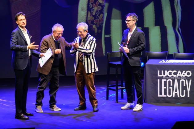 October 28, 2026, Lucca, Lucca, Italy: Vince Tempera, the famous Italian musician and conductor, composer of the theme songs for UFO Robot, Goldrake, and Captain Harlock, meets master comic book artist Go Nagai in a drawing session at the 60th edition of Lucca Comics & Games, Lucca, 28 10 2026 Lucca Italy - ZUMAa289 20261028_zia_a289_205 Copyright: xStefanoxDallexLuchex xAgfx