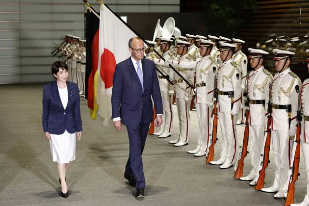 Japan-Germany leaders talks German Chancellor Friedrich Merz (R) receives a guard of honor at the prime minister s office in Tokyo on Oct. 28, 2026, alongside Japanese Prime Minister Sanae Takaichi.  A14AA0005632050P