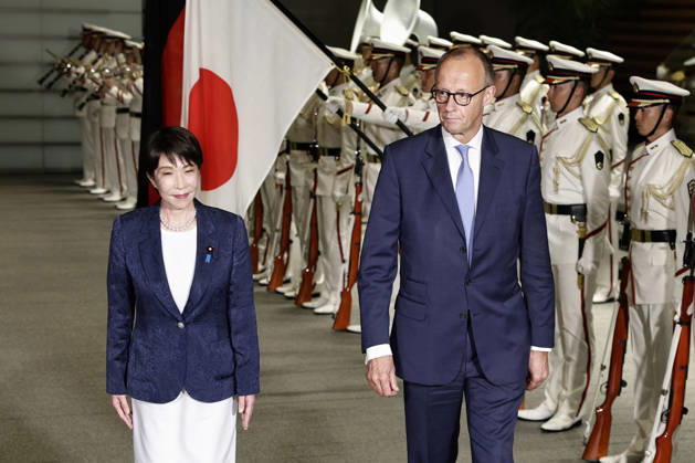 Japan-Germany leaders talks German Chancellor Friedrich Merz (R) receives a guard of honor at the prime minister s office in Tokyo on Oct. 28, 2026, alongside Japanese Prime Minister Sanae Takaichi.  A14AA0005632051P