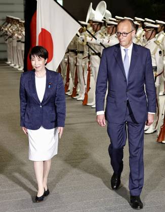 Japan-Germany leaders talks German Chancellor Friedrich Merz (R) receives a guard of honor at the prime minister s office in Tokyo on Oct. 28, 2026, alongside Japanese Prime Minister Sanae Takaichi.  A14AA0005632052P