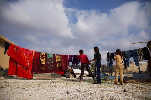 Flooding Damages Al-Talai Displacement Camp Displaced residents stand beside blankets and clothing hung on lines between temporary shelters at Al-Tala i camp in Al-Hasakah, Syria, on October 29, 2026. Heavy rain on October 28-29 flooded tents at Al-Tala i, also known as Serekaniye camp, which shelters families displaced from Ras al-Ain, damaging bedding and belongings and prompting calls for humanitarian assistance. Al á¸¨asakah Al-Hasakah Syria Copyright: xMohammedxMirx
