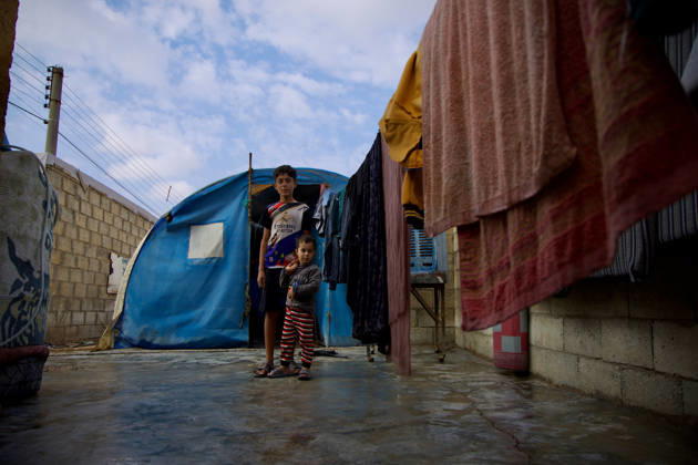 Flooding Damages Al-Talai Displacement Camp Two children stand outside a tarpaulin-covered shelter along a narrow wet passage at Al-Tala i camp in Al-Hasakah, Syria, on October 29, 2026. Heavy rain on October 28-29 flooded tents at Al-Tala i, also known as Serekaniye camp, which shelters families displaced from Ras al-Ain, damaging bedding and belongings and prompting calls for humanitarian assistance. Al á¸¨asakah Al-Hasakah Syria Copyright: xMohammedxMirx