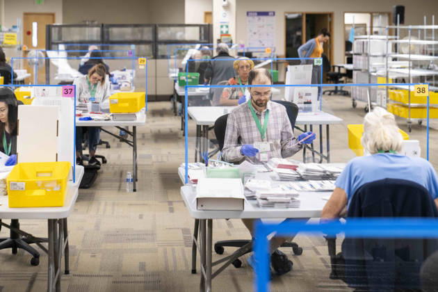 October 29, 2026, Renton, Washington, USA: Workers open mail-in ballots in a secure room for the 2026 mid-term election at the King County Elections office in Renton, Washington, USA, on Thu., Oct. 29, 2026. Approximately 98% of votes cast in Washington state are mail-in ballots. Renton USA - ZUMAb344 20261029_znp_b344_002 Copyright: xM.xScottxBrauerx