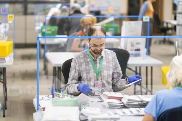 October 29, 2026, Renton, Washington, USA: Workers open mail-in ballots in a secure room for the 2026 mid-term election at the King County Elections office in Renton, Washington, USA, on Thu., Oct. 29, 2026. Approximately 98% of votes cast in Washington state are mail-in ballots. Renton USA - ZUMAb344 20261029_znp_b344_003 Copyright: xM.xScottxBrauerx