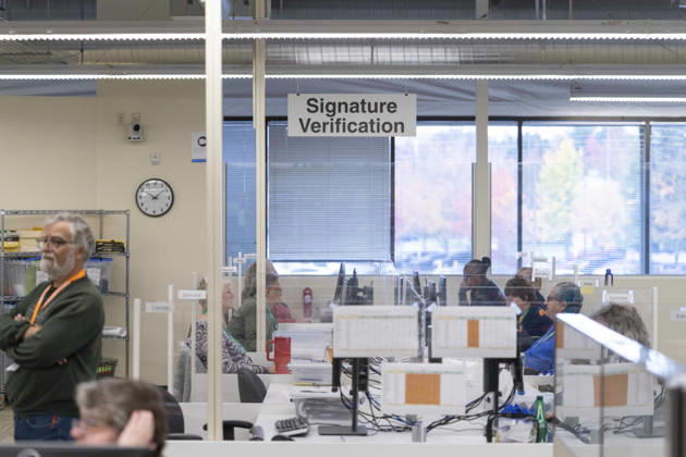 October 29, 2026, Renton, Washington, USA: Workers in the Signature Verification look at ballot signatures in a secure room as 2026 mid-term election ballots are opened and counted at the King County Elections office in Renton, Washington, USA, on Thu., Oct. 29, 2026. Approximately 98% of votes cast in Washington state are mail-in ballots. Renton USA - ZUMAb344 20261029_znp_b344_006 Copyright: xM.xScottxBrauerx