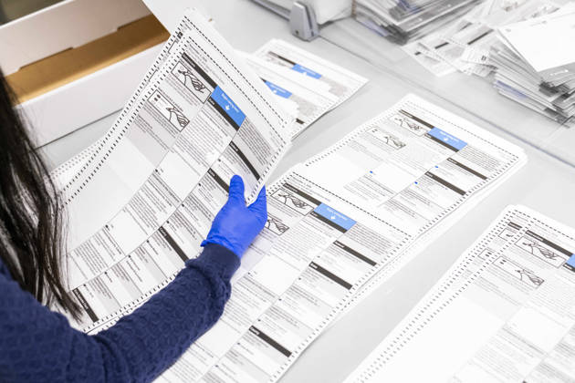 October 29, 2026, Renton, Washington, USA: Workers open mail-in ballots in a secure room for the 2026 mid-term election at the King County Elections office in Renton, Washington, USA, on Thu., Oct. 29, 2026. Approximately 98% of votes cast in Washington state are mail-in ballots. Renton USA - ZUMAb344 20261029_znp_b344_016 Copyright: xM.xScottxBrauerx