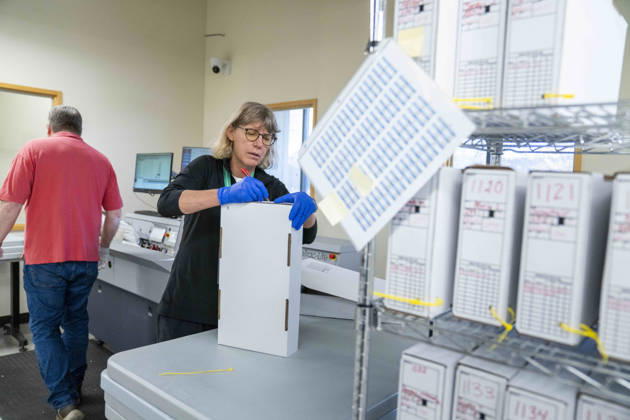 October 29, 2026, Renton, Washington, USA: A worker secures ballots after they have been scanned by a machine in a secure room as 2026 mid-term election ballots are opened and counted at the King County Elections office in Renton, Washington, USA, on Thu., Oct. 29, 2026. By state law, votes cannot be tabulated until after 9pm on election day, so the the ballots are only scanned at this point. Approximately 98% of votes cast in Washington state are mail-in ballots. Renton USA - ZUMAb344 20261029_znp_b344_029 Copyright: xM.xScottxBrauerx