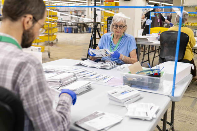 October 29, 2026, Renton, Washington, USA: Workers open mail-in ballots in a secure room for the 2026 mid-term election at the King County Elections office in Renton, Washington, USA, on Thu., Oct. 29, 2026. Approximately 98% of votes cast in Washington state are mail-in ballots. Renton USA - ZUMAb344 20261029_znp_b344_034 Copyright: xM.xScottxBrauerx