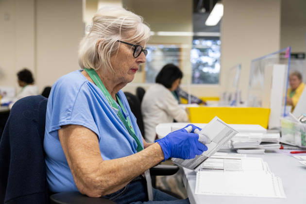 October 29, 2026, Renton, Washington, USA: Workers open mail-in ballots in a secure room for the 2026 mid-term election at the King County Elections office in Renton, Washington, USA, on Thu., Oct. 29, 2026. Approximately 98% of votes cast in Washington state are mail-in ballots. Renton USA - ZUMAb344 20261029_znp_b344_051 Copyright: xM.xScottxBrauerx