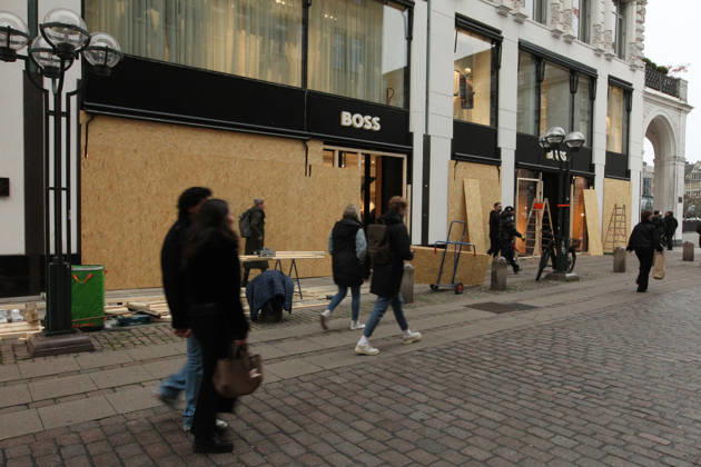 Hugo Boss store on Neuer Wall. The store s windows were barricaded with wooden panels out of fear of vandalism during Saturday s Gen Z demonstration in downtown Hamburg. Hamburg s Old Town