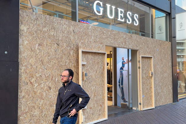 NETHERLANDS, THE HAGUE - OCTOBER 30, 2026: A view of a boarded up Guess clothing boutique amid fears of looting over calls for a youth protest. On 29 October 2026, the media outlet GeenStijl reported about calls to stage riots on 31 October, in the wake of recent unrest in France, and threats against the Dutch royal family circulating across Dutch social media platforms. Natalya Blinova TASS  100232557