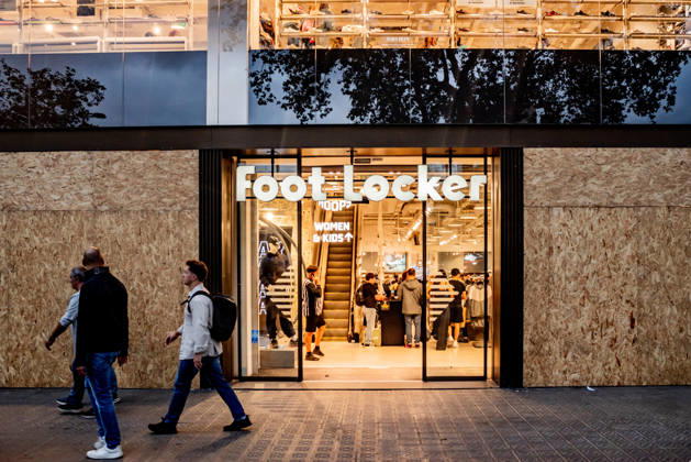 October 30, 2026, Barcelona, Spain: People passes by Foot Locker store with its windows boarded up in Barcelona on Friday, amid concerns over possible demonstrations called by the group Blocus during the Halloween and traditional Catalan Castanyada weekend celebrations. Businesses across the city centre are taking precautionary measures following riots and looting last week after an online call for a gathering. Barcelona Spain  - ZUMAb137 20261030_fap_b137_014 Copyright: xJordixBoixareux
