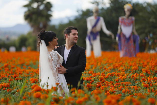 People visit marigold fields ahead of the Day of the Dead celebrations TLAJOMULCO, MEXICO - OCTOBER 30: A couple pose in a field of marigolds, known locally as cempasuchil, at a ranch in the municipality of Tlajomulco de Zuniga, Jalisco state, Mexico, Friday, October 30, 2026. The vibrant orange flower fields attract thousands of visitors each year ahead of the traditional Day of the Dead celebrations. Stringer Anadolu Tlajomulco Mexico. Editorial use only. Please get in touch for any other usage.  Copyright: x2026xAnadoluxStringerx
