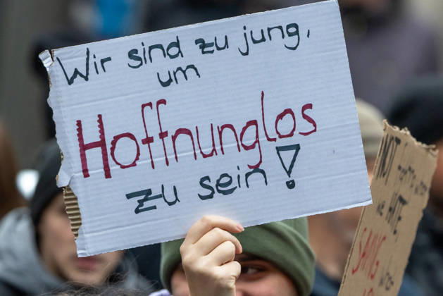 Gen Z Takes Charge: Hundreds March Through the Old Town and Südstadt, Nuremberg, October 31, 2026 During a protest march organized by the Gen Z Regelt initiative, a participant holds up a cardboard sign reading We’re too young to be hopeless. The nationwide initiative is c 20261031-1V9A3925-M4000