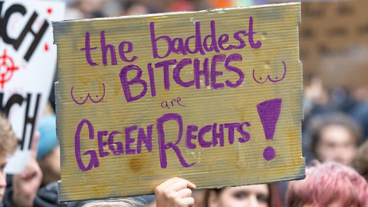 Gen Z Takes Charge: Hundreds March Through the Old Town and Südstadt, Nuremberg, October 31, 2026: At a rally organized by the Gen Z Regelt initiative, a protester holds up a cardboard sign reading The baddest BITCHES are AGAINST THE RIGHT. The nationwide initiative is calling for 20261031-1V9A3952-M4000