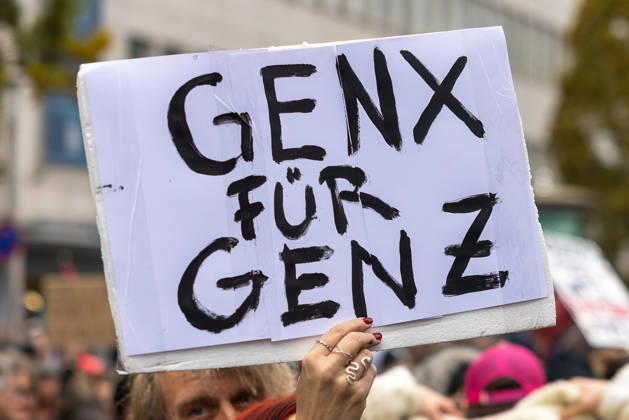 Gen Z Takes Charge: Hundreds March Through the Old Town and Südstadt, Nuremberg, October 31, 2026 At a rally organized by the Gen Z Regelt initiative, a participant holds up a hand-painted sign reading GENX FOR GENZ. The nationwide initiative is calling for more funding for education and healthc 20261031-286A1951-M4000