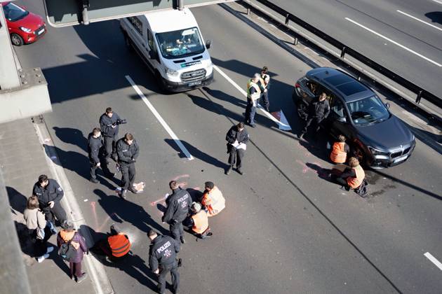 Berlin, Last Generation climate activists at roadblock on A100