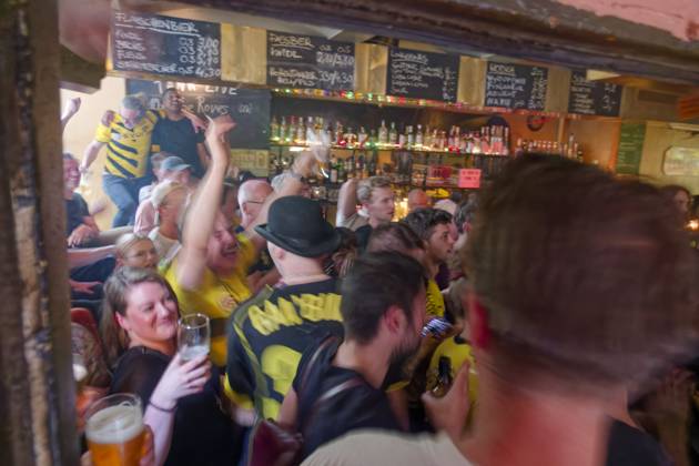 Berlin, Borussia Dortmund fans celebrate their teams victory in pub