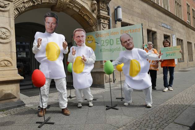 Germany, Attac protest action Stop the egg dance - 290 euros climate money now in Berlin