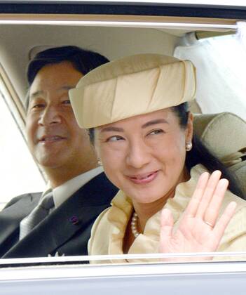 Crown Prince Naruhito with wife in front of palace in Tokyo