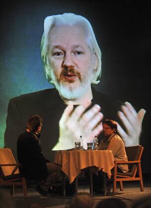 Julian Assange speaks via video conference at documentary film festival in Jihlava