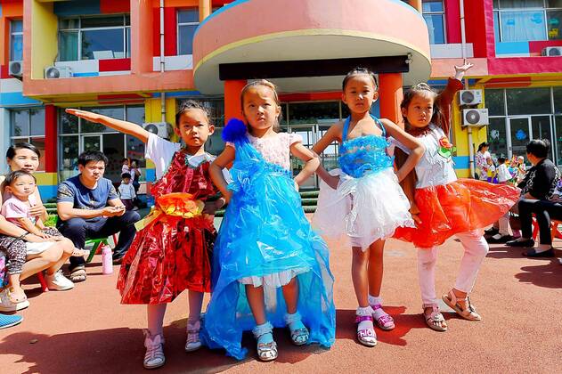 Children present fashion made of recyclable material